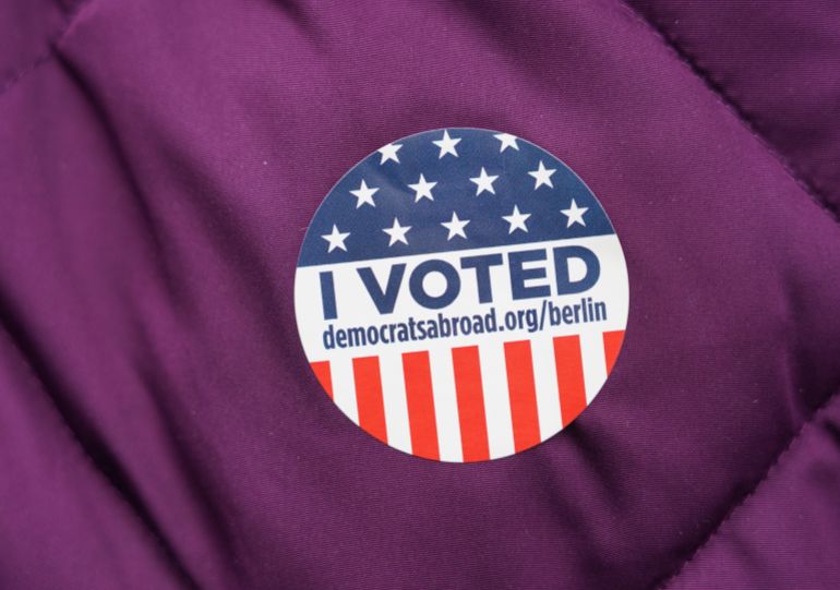 BERLIN, GERMANY - MARCH 08: A US exporter carries "I voted" A sticker after she cast her vote in the US Democratic primary election on March 08, 2020, at a polling place hosted by Democrats Abroad in Berlin, Germany. Bernie Sanders and Joe Biden will face each other as the two main Democratic candidates before the US presidential elections scheduled for November. (Photo by Sean Gallup/Getty Images)