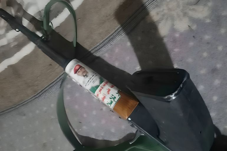 ****INTERIOR**** A Kalashnikov rifle (AK-47) with its wooden handle with ideological slogans belonging to the Houthi group. It was captured by government forces in Taiz on the Eastern Front.