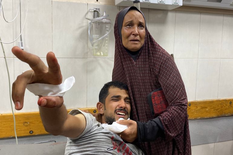 A wounded Palestinian man waits for medical treatment at Khan Younis Nasser Hospital in the southern Gaza Strip on June 19, 2025.