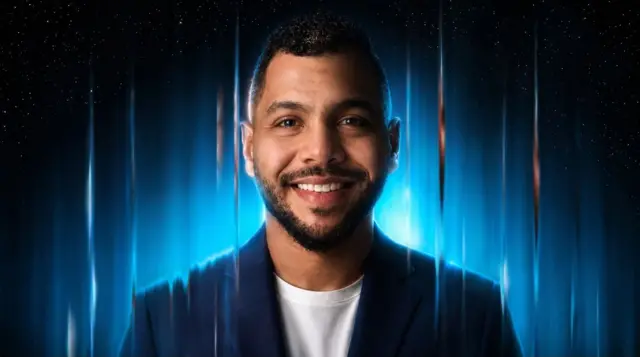 Mahmoud Gomaa, director and producer of the commercial, with a blue background made of visual effects behind him.