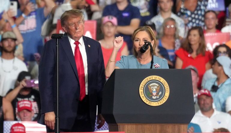 President Donald Trump looks at Sen. Darlene Graham, left. RS.C. speaks at a campaign rally as she competes in a special Republican primary to replace her brother, the late Sen. Lindsey Graham, RS.C., Friday, Aug. 21, 2026, in Myrtle Beach, SC (AP Photo/Meg Kinnard)