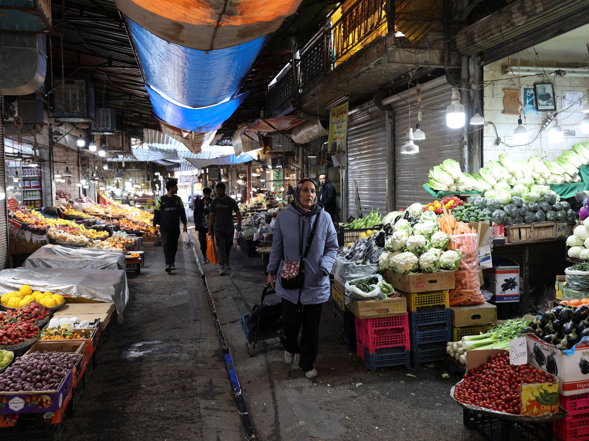 Economic pressures are reaching Iranians’ desks, and the government is warning against protests