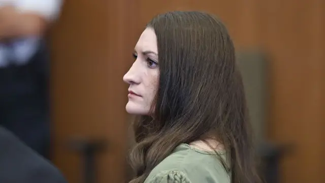 Lindsay Clancy looks on as jurors (behind frame) are brought into the courtroom during her murder trial at Plymouth County Superior Court in Plymouth, Massachusetts, on September 4, 2026. Lindsay Clancy's trial in January 2023 for the suffocation of her three young children.