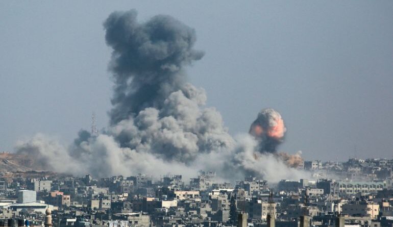 A plume of fire and smoke erupts on June 18, 2025, following the bombing of areas east of Tufah neighborhood in the eastern Gaza City. (Photo by Bashar TALEB / AFP)